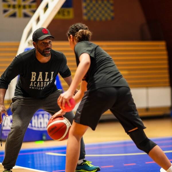 Antoine Gillespie playing defense during skills training practice