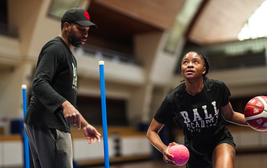 Muji Vader training with a mini ball and basketball with Antoine Gillespie