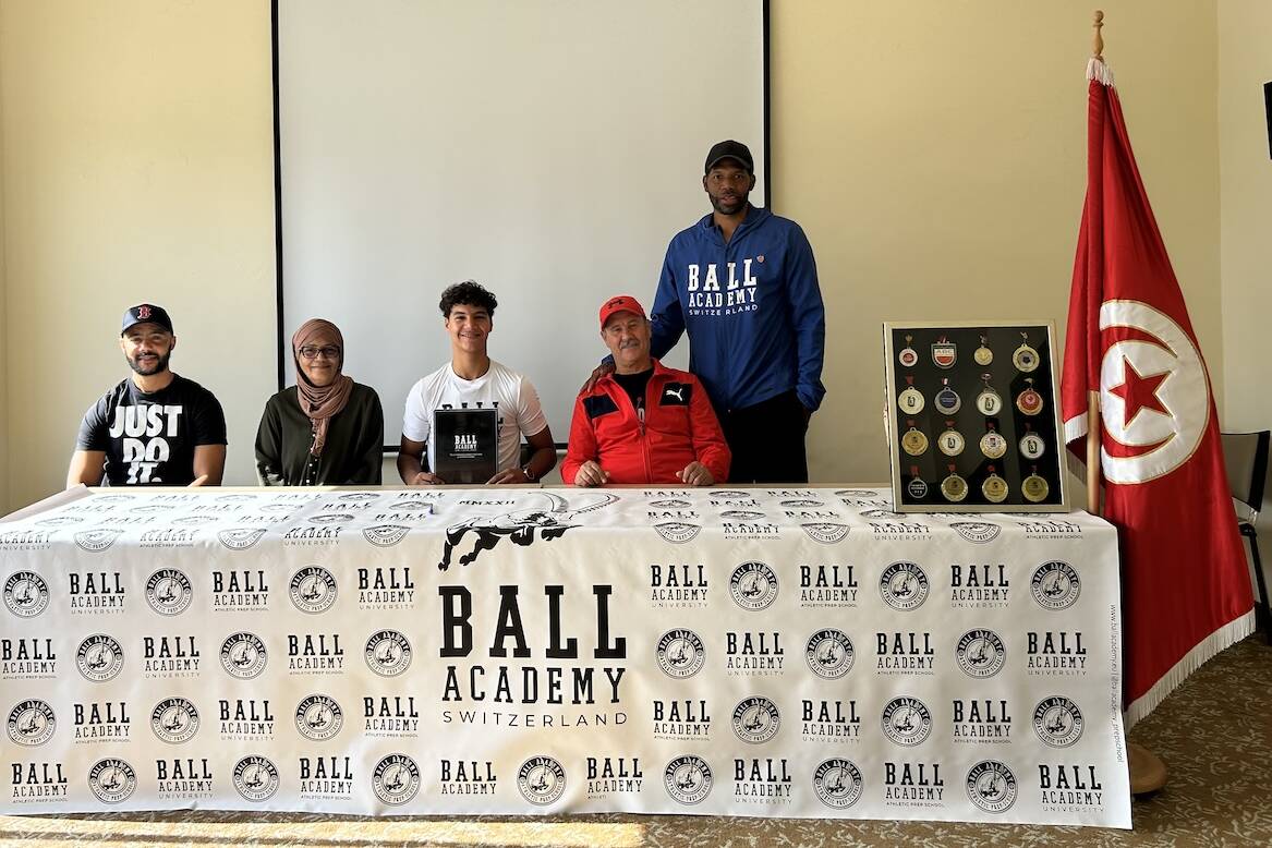 Adem Rafrafi and his family with Antoine Gillespie at signing with Antoine Gillespie, Ball Academy in Tunisia